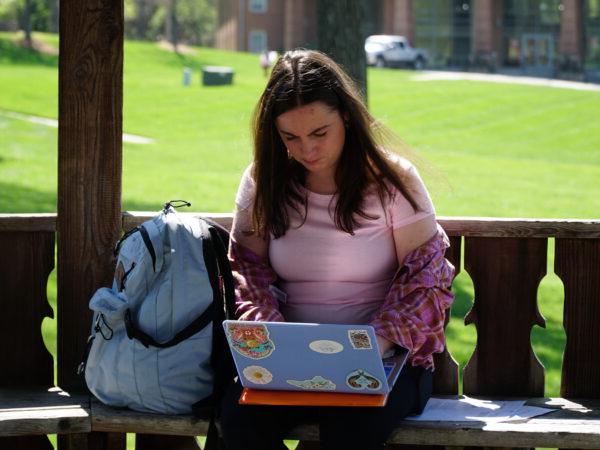 Student studying on Campus lawn